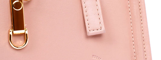 Compact everyday sling bag carried on the shoulder