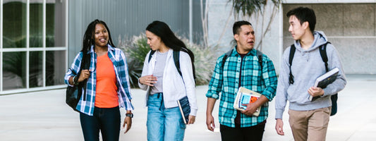 College students walking on campus with backpacks