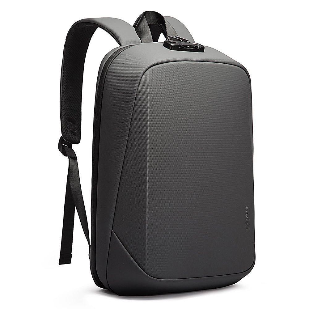 Slim grey anti-theft backpack with TSA lock, padded straps, and minimalist hard-shell front.