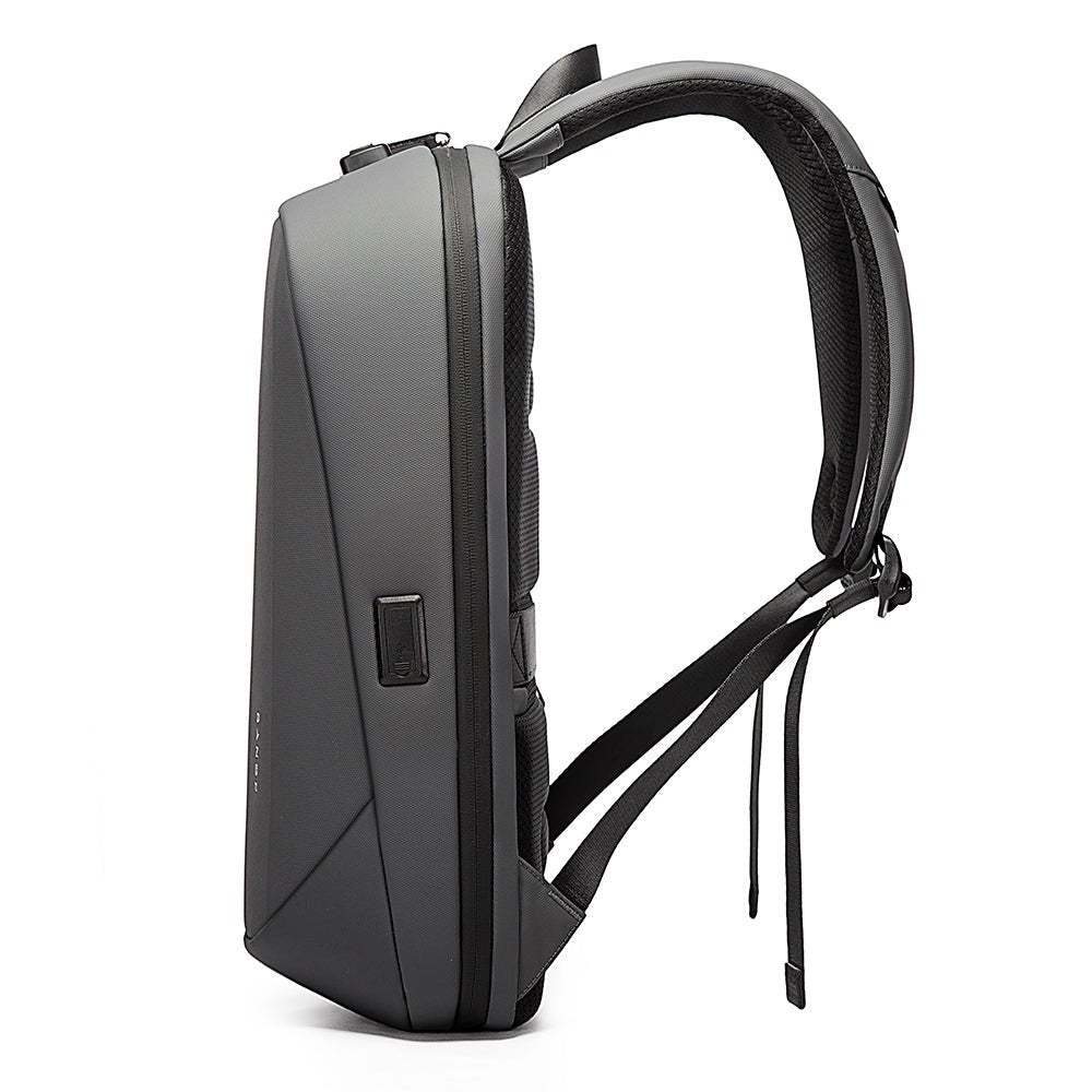 Side view of grey BANGE backpack with USB port, padded straps, and slim anti-theft design.