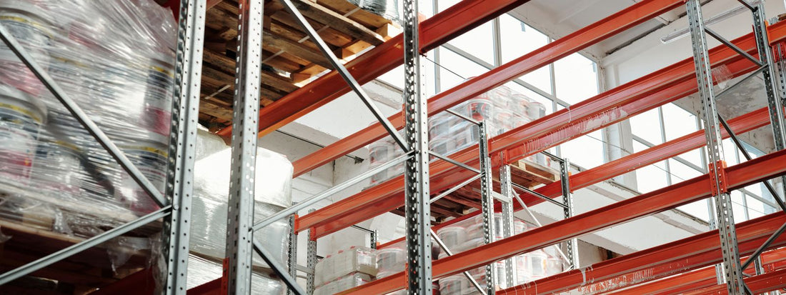 Stacked pallets of stock in a warehouse