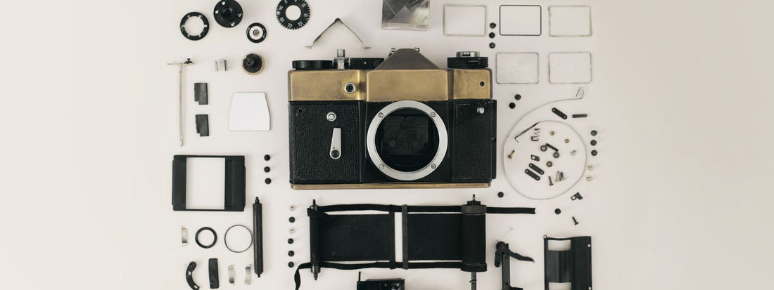 DSLR camera and lenses laid out flat