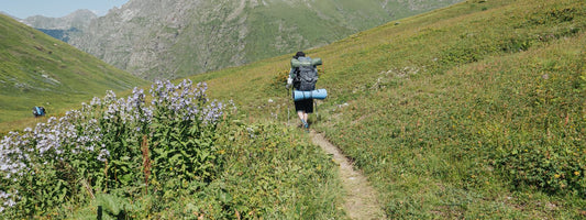 Person carrying a backpack outdoors
