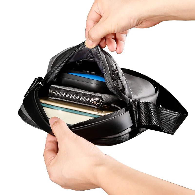 Interior view of Nytra BANGE 2876 crossbody bag displaying organized compartments with tech gadgets and accessories inside.