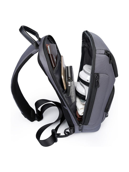 Open 7565 model zynova gray backpack with organized compartments containing a laptop