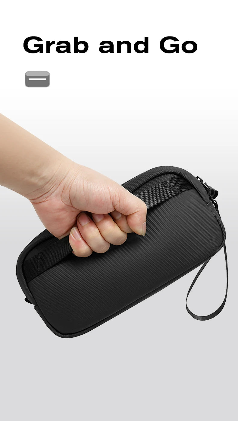 Hand carrying the BANGE 3066 pouch by its top grab handle