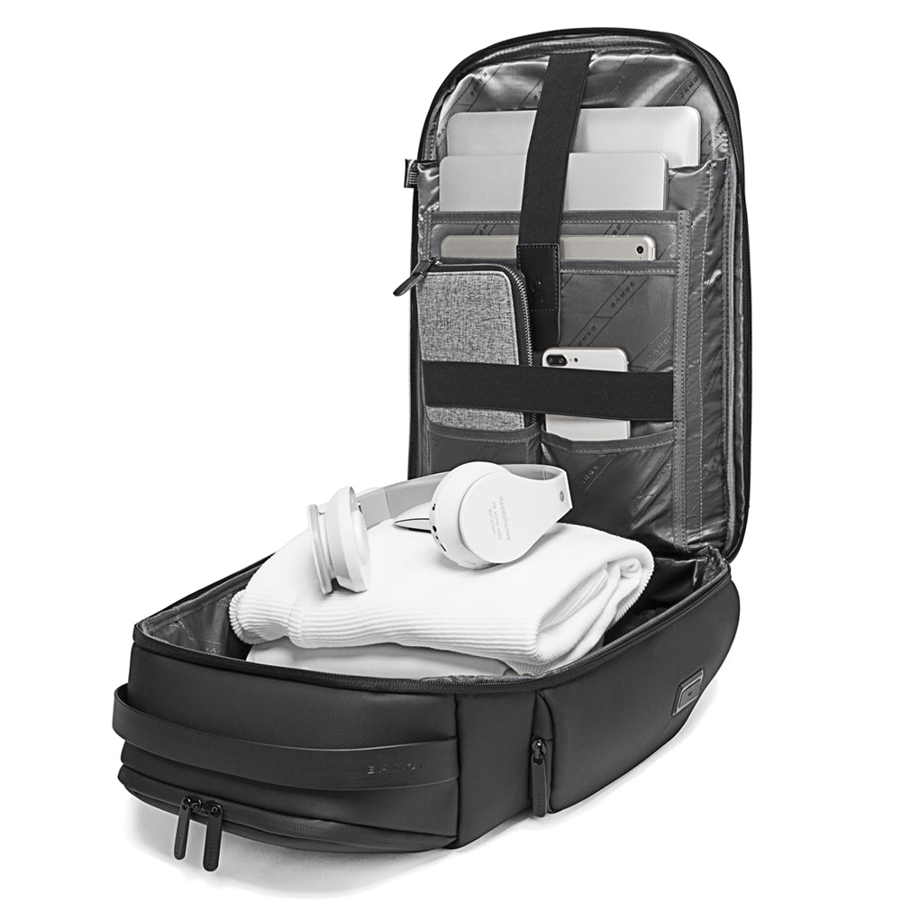 BANGE 7277 Astraq black backpack interior open with organized compartments for laptop, tablet, smartphone, and accessories on a white background