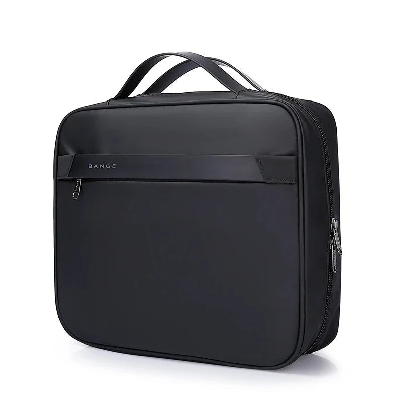 Front view of black BANGE travel garment bag with square structured design, top carry handles, and front zip pocket