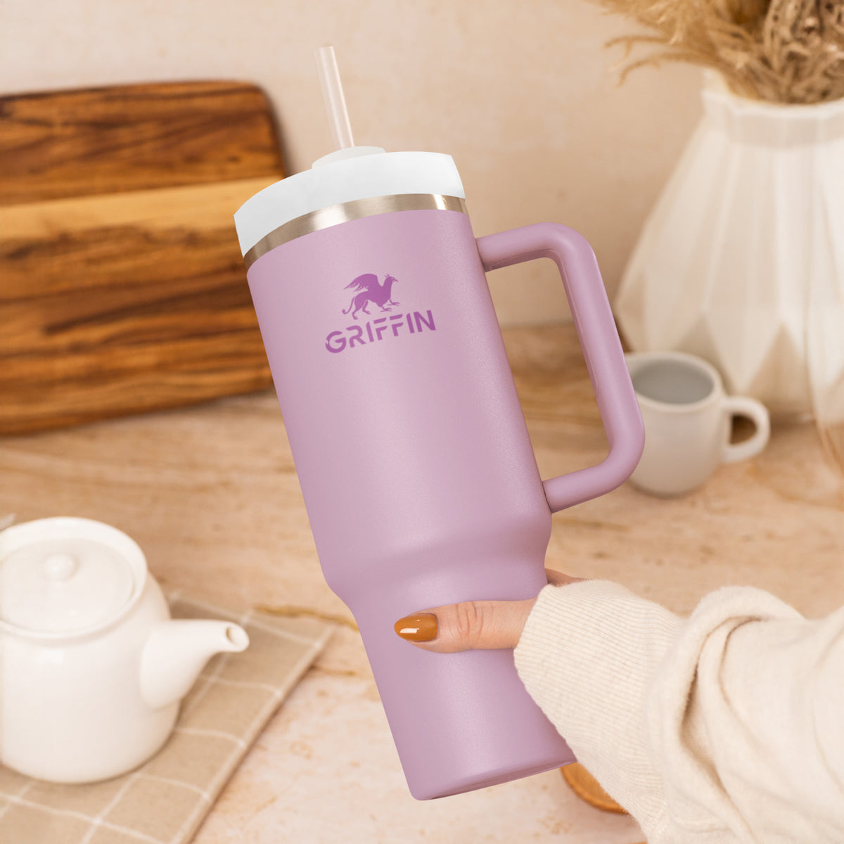Orchid Griffin tumbler held on a kitchen table