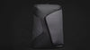 Sleek black anti-theft backpack with modern geometric design and secure zippers, displayed against a dark background.